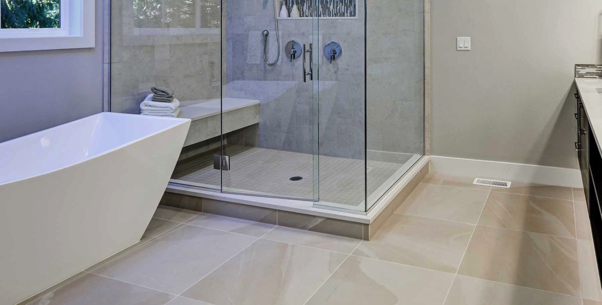 new and contemporary bathroom with large glass shower room