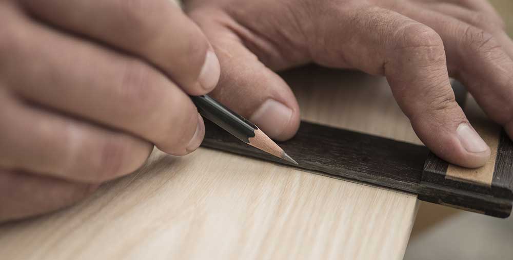 carpenter preparing draws fronts for bespoke kitchen
