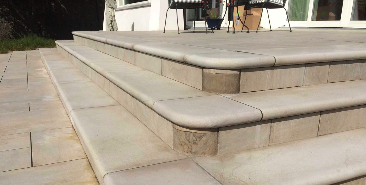 hand crafted stone steps leading up to a new summer room of residential property in Aberdeen